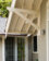 Exterior, detail of the covered entry to the Family Room. The supporting bracket recalls that of the existing house. Sears, Roebuck and Co. Remodel and Cottage, after. Photo by John Magor for James Hricko Architect LLC.